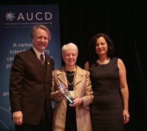 Joann Bodurtha (center) accepts the 2009 Outstanding Achievement Award with AUCD President Michael Gamel McCormick (left) and AUCD President-Elect Tamar Heller (right)