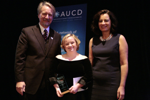 Bridget Brown (center) receives the 2009 Leadership in Advocacy Award with AUCD President Michael Gamel McCormick (left) and AUCD President-Elect Tamar Heller (right)