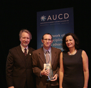 Paul Carbone (center) receives the 2009 Meritorious Service Award with AUCD President Michael Gamel McCormick (left) and AUCD President-Elect Tamar Heller (right)