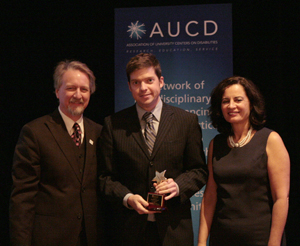 Ken DeGraff (center) receives the 2009 AUCD Gold Star Award with AUCD President Michael Gamel McCormick (left) and AUCD President-Elect Tamar Heller (right)