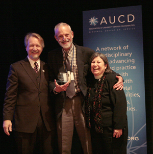 Harold Kleinert, Director of the Human Development Institute (center) accepts the 2009 Young Professional Award on behalf of Kathleen Sheppard-Jones with AUCD President Michael Gamel McCormick (left) and AUCD Past- Past President Lu Zeph (right)