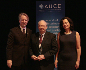 Mike Liebowitz, Director of the Munroe-Meyer Institute (center) accepts the 2009 Council on Community Advocacy Award with AUCD President Michael Gamel McCormick (left) and AUCD President-Elect Tamar Heller (right)