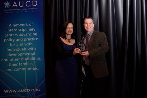 David Morrissey accepts the 2010 AUCD International Service Award on behalf of Barbara LeRoy
