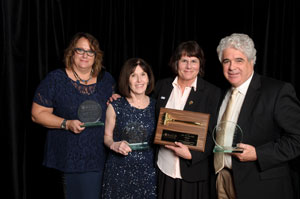 Julie Fodor (3rd from left) with outgoing AUCD Board members Amy Hewitt, Sandy Friedman, and Dan Crimmins