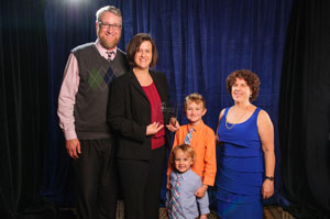 Award recipient Jessica Jagger with family and AUCD Boad President Leslie Cohen