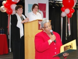 Honoree State Senator Shirley Kitchen reads a congratulatory proclamation from the Pennsylvania Senate to the Institute on Disabilities at Temple University, while co-executive directors Amy Goldman (left) and Celia Feinstein look on.
