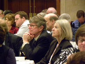 Bob Bacon and Lenore Holte (IA UCEDD/LEND) listen to speakers.