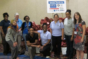 Child Thrive AmeriCorps Members with Nancy Keeler in front of completed summer supply kits.