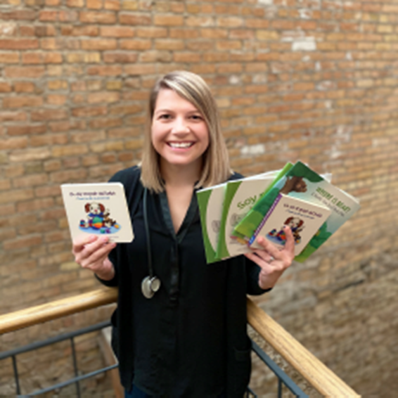 Woman smiling with children's' books