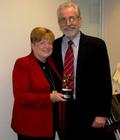 AUCD President Bill Kiernan (R) presents AUCD's Gold Star Award to Connie Garner