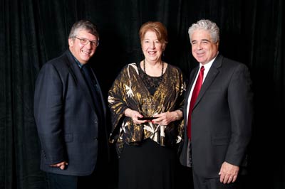 Vicki Pappas (center) with AUCD President-Elect Tony Antosh and AUCD President Dan Crimmins