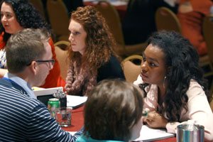 photo: trainees talking across a table