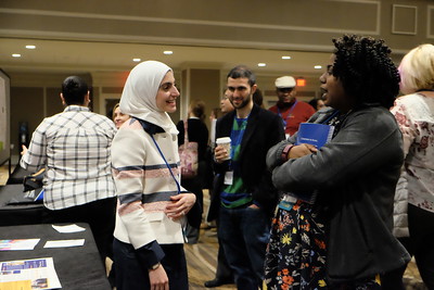 Image of a conference attendees in conversation.