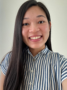 Image of a Asian American woman with shoulder thength hair wearing a striped blouse.