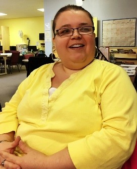 Image of woman with a yellow shirt.