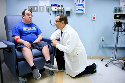 Matt Miller Neurologist Beau
Ances, MD, PhD, talks with his patient, Adam Kloppenberg, who has Down syndrome, at Washington University School of Medicine in St. Louis. 