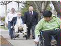 Juan and Metro Councilor Robert Liberty explore the sidewalks of Cornelius in wheelchairs