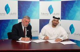 Dr. Haidar Al Yousuf (R) with Dr. George Jesien at the signing of the agreement.
