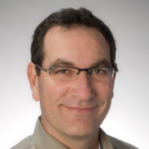 Smiling headshot of Gary Stobbe, a white man with short, dark hair and glasses.