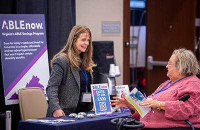 Exhibitor talking to attendee