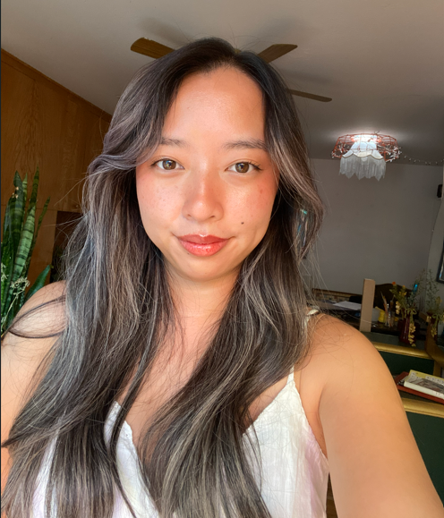 Photo of woman with long hair and white shirt