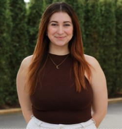 woman with long brown hair and black shirt