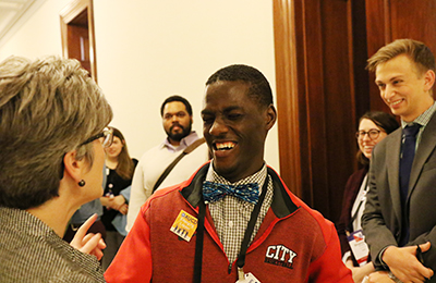 Emerging leader talking to congresswoman.