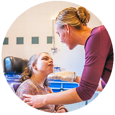A provider working with a client using a wheelchair.