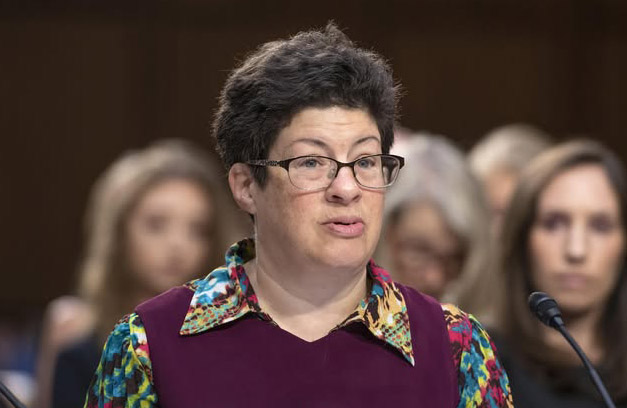 Image of Liz Weintraub testifying at a Senate hearing. 