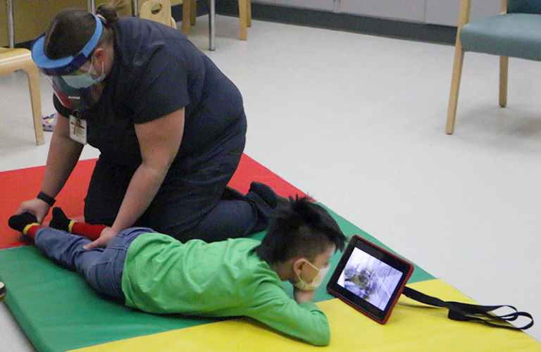 Sebastian Sundly receives therapy at the Waisman Center cerebral palsy clinic 