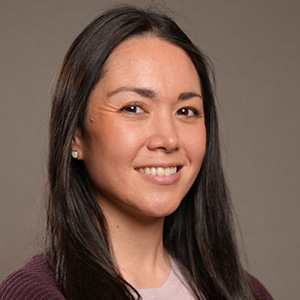 Image of Kristine Nellenbach, a smiling woman with long brown hair. 